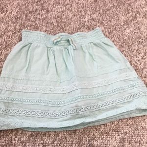 Cute turquoise lacy skirt.